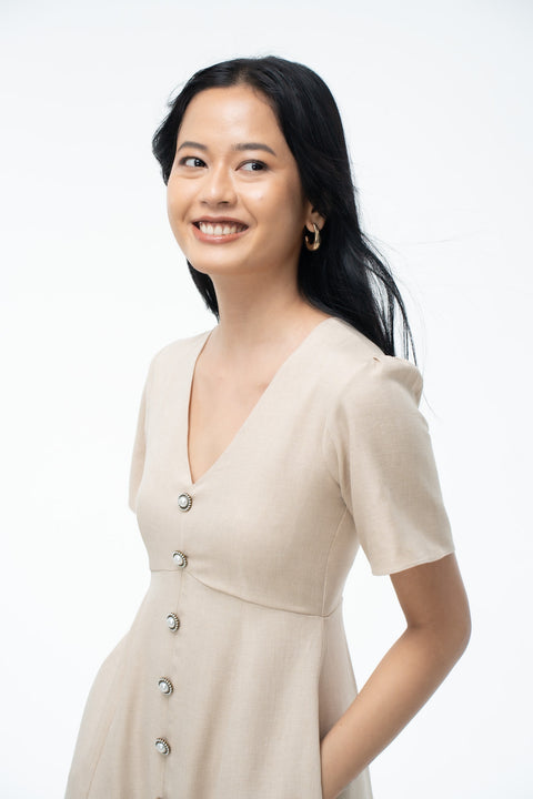 Audrey Beige v-neck button-front midi dress by Mazikien, front view