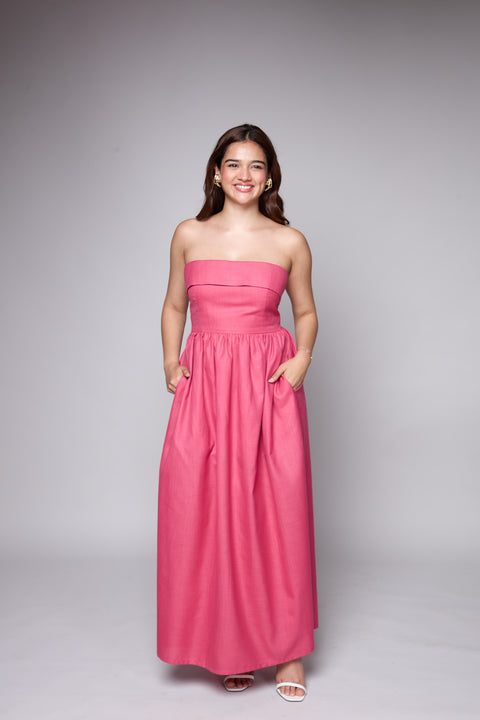 Poppy Pink strapless maxi gown with slit by Mazikien, front view