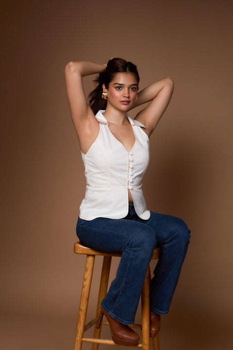 Sheri White collared denim vest top with peplum hem by Mazikien, front view